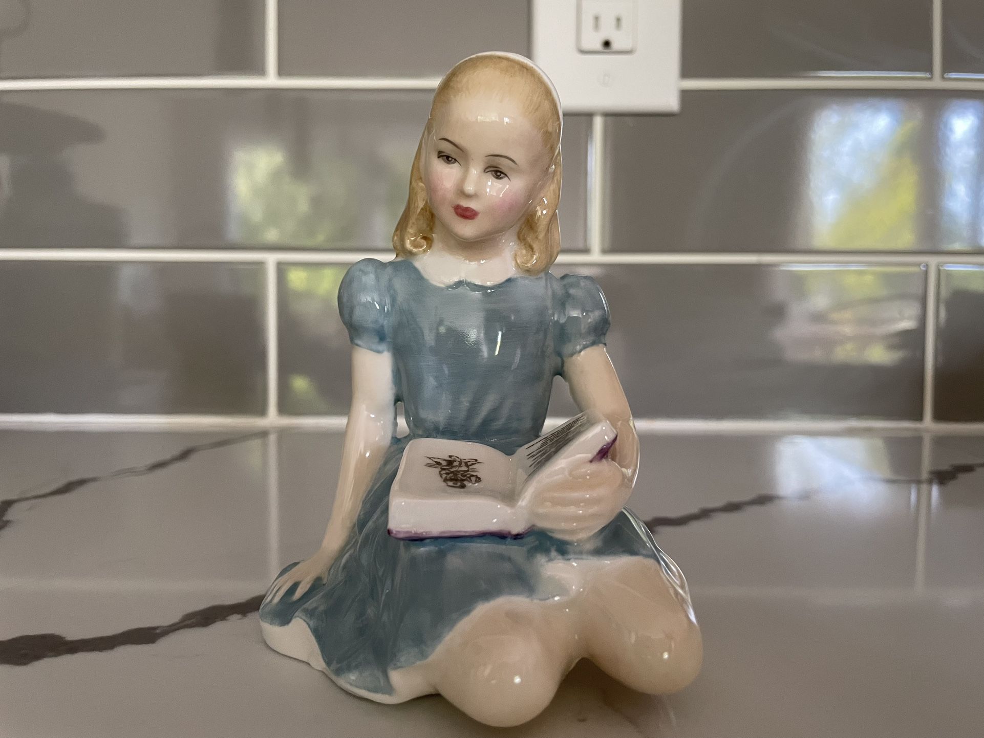 Royal Doulton figurine of Alice from "Alice in Wonderland”