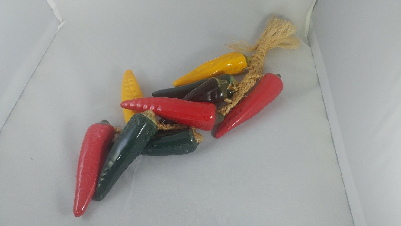 Ceramic hanging peppers on a rope