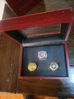 All 3 Chicago Cubs Champion ring replicas in a case