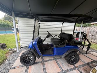 Custom lifted golf cart