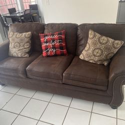 2 Barely Used Big Couches With Side Table. One Of The Couches Doubles As A Bed.