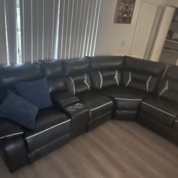 Sectional Coach With Recliner And Charging Station And Cup Holder 
