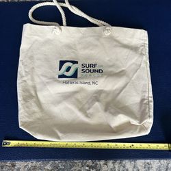 Canvas tote bag with Surf or Sound Realty logo. 