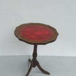 VINTAGE BROWN LEATHER TOP PLANT WINE SIDE STAND ON TRIPOD. Pre owned in good with minor cosmetic blemishes. These blemishes are in the form of minor s