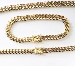 New 18 k yellow gold Cuban link chain and bracelet