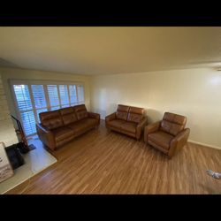 Abbyson Leather reclining couch set 