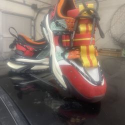 Javi Hype sneakers in a multicolored red, orange, yellow, and aqua design. [1, 2]    AI can make mistakes, so double-check responses  [1] ht