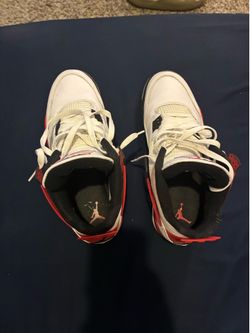 Red and white Jordan 4s