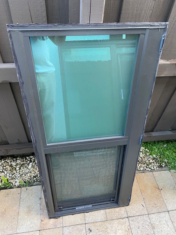 PGT impact window 47 by 23 impact window. Bronze color for Sale in