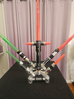 2 Star Wars light saber toys