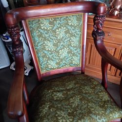Antique hand carved rocking chair.