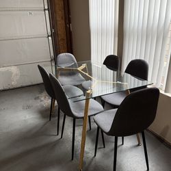 Glass Table with Metal Frame and Six Chairs