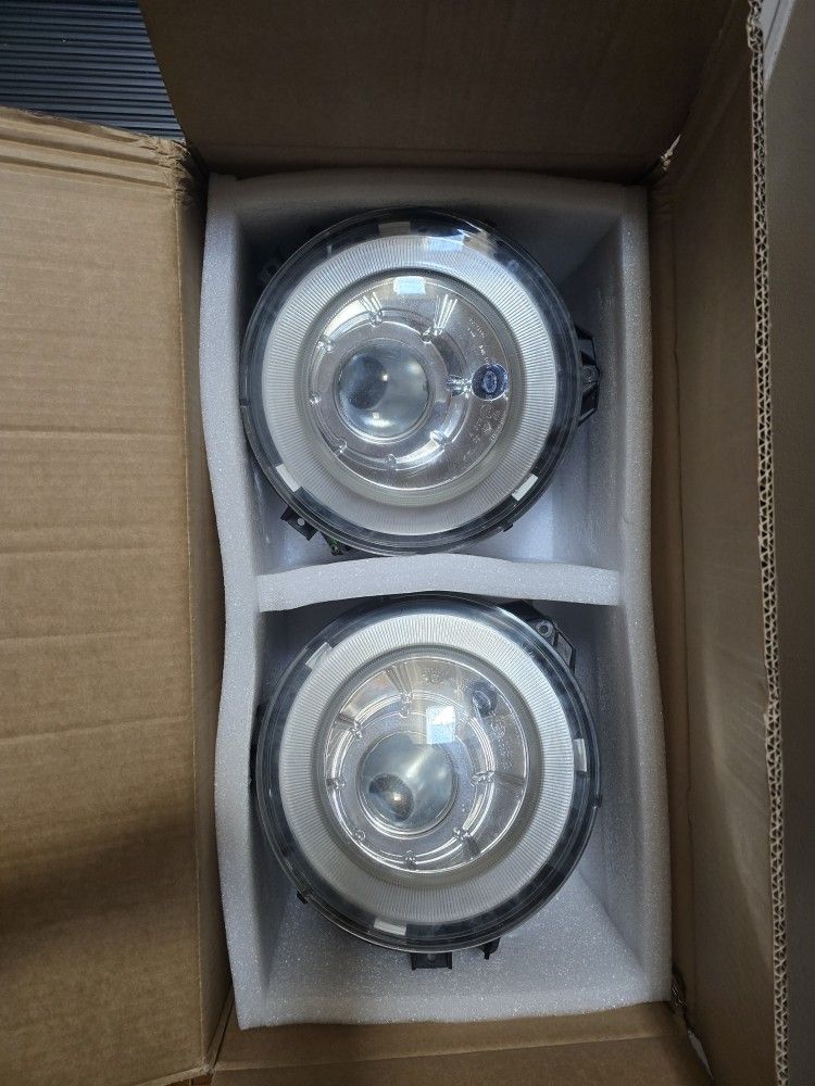 Mercedes G(contact info removed) OEM
LEFT AND RIGHT HID OEM headlights