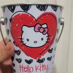 Hello Kitty themed bucket or pail, likely used for decorative purposes, storage, or as a party favor container. 