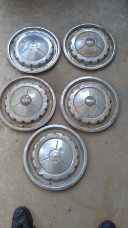 Vintage 57 Chevy era hubcaps