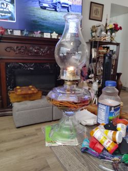 Very old antique oil lamp great working condition no chips original globe I was told by the person I purchased it from they was their grandmother's so