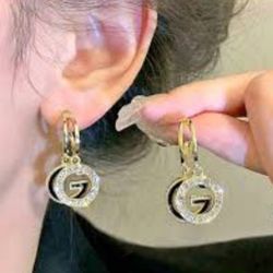 Gold and Silver Two-Tone Dangle Earrings with Circular Pendant
