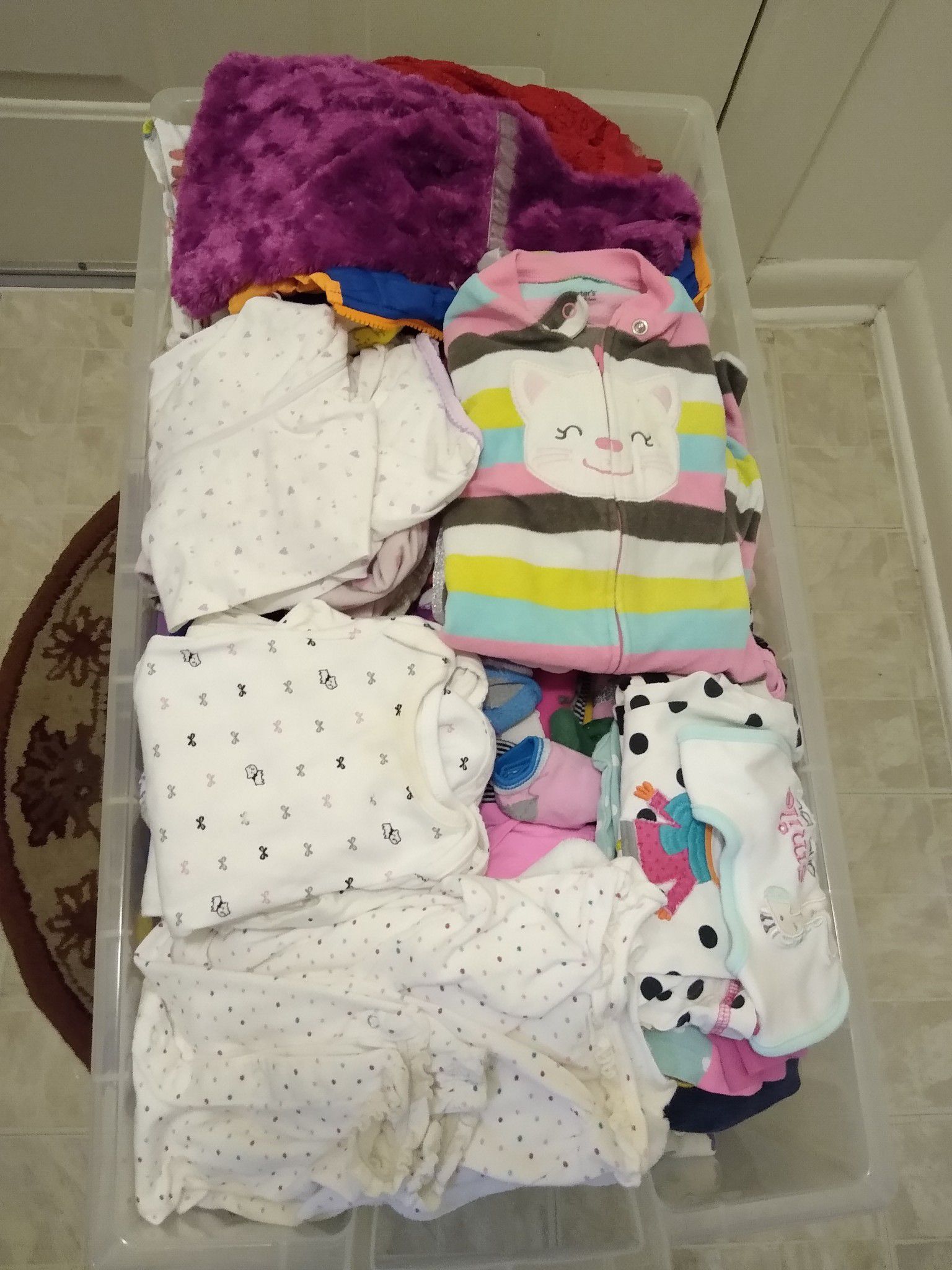 Baby clothes fifty cents each I have one big container