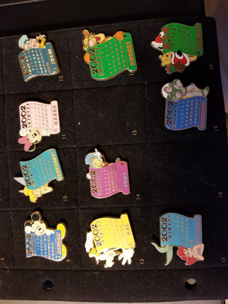Two incomplete sets of Disney pins.