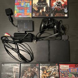 PlayStation 2 Slim with 7 Games and MultiTap