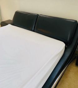 Leather cal king bed frame with two night stands.!