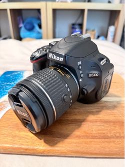 Nikon D5100 with lens