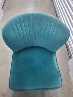 Green chair with gold legs