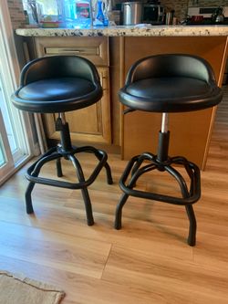 Two Winplus swivel black stool with adjustable height and excellent cushion padding