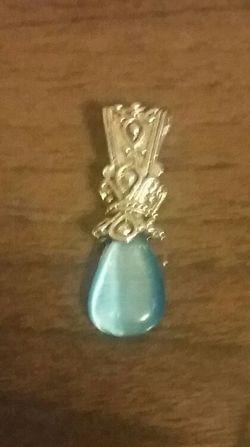 Sterling silver pendant with a light blue stone