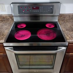 LG, STAINLESS  STEEL ELECTRIC STOVE.  ( Read Add Please)