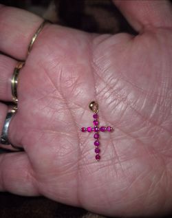Genuine 14kt gold pendant with natural rubies.
