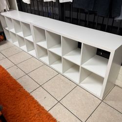 IKEA KALLAX shelves—two 8-cube units and one 2-cube unit.