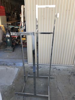 Two Adjustable chrome Tshirt racks.