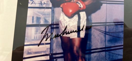 Muhammad Ali autographed photo. With COA