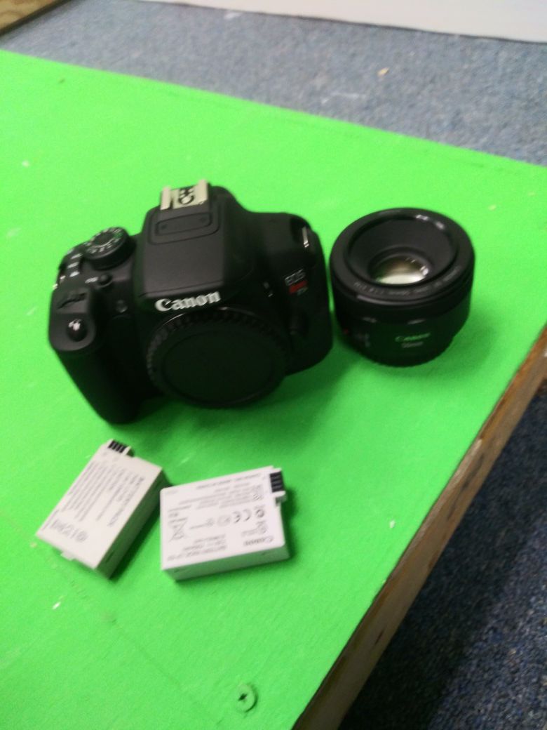 Canon t5i with 50mm prime lens, battery, charger and camera bag