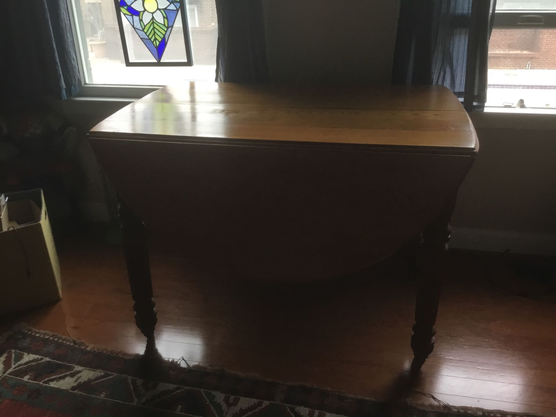 Oak 20th ? century drop leaf table. Original casters.