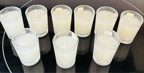 Votive candles in glass cups, 9 total.