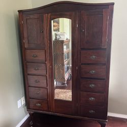 Antique 10 drawer armoire with mirrored middle door 