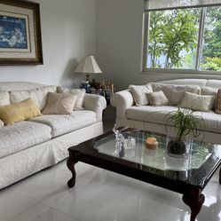 A Set Of sofas With End Table And Coffee Table