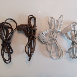 Four indoor 6 foot extension cords 2 prong with 3 outlet Ends