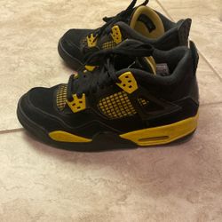 Used Jordan 4s   Size 4 Youth.  Black And Yellow