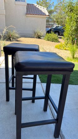 2 brown stool chairs