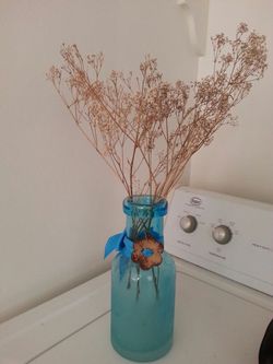 Small decoration vase with dry flowers