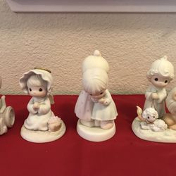 A group of 4 vintage Precious Moments figurines