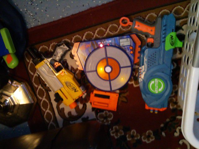 Two Nerf Guns One With A Magazine And A Nerf Elite Target