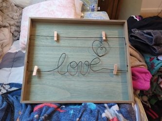 Wall hanging picture that holds pictures