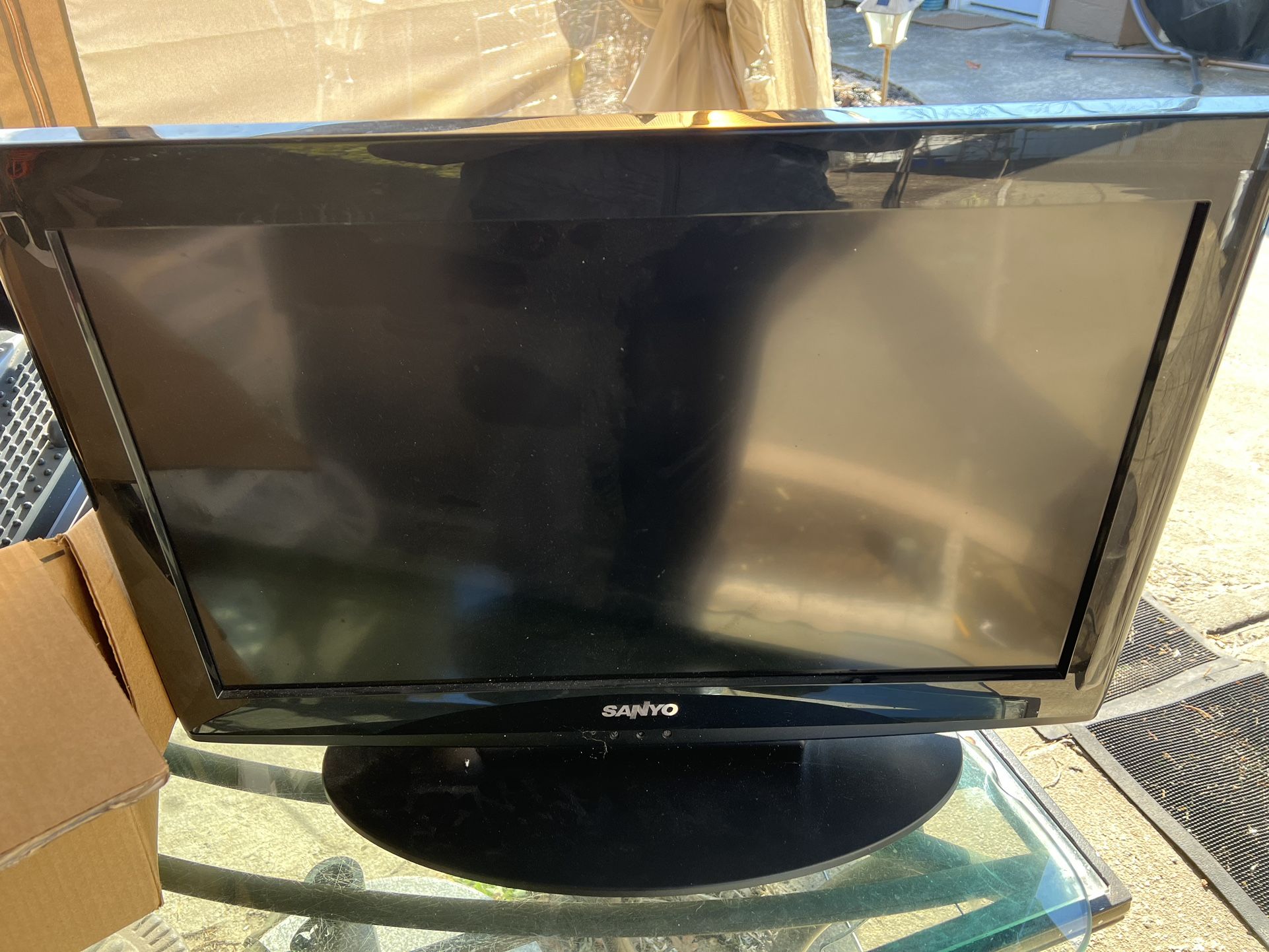 Sanyo 26" LCD TV with stand and remote.