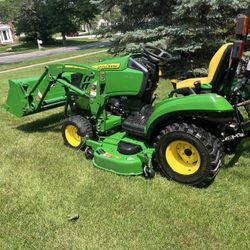 John Deere 1023e Diesel Compact 4x4  Tractor With A Loader And 60 In Lawnmower Deck