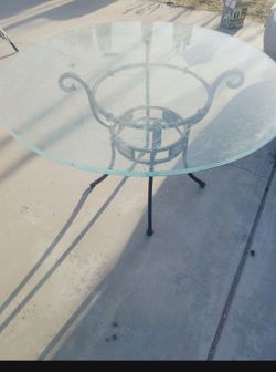 Glass Round Table 47 And A Half Inches Diameter 2 blue chairs