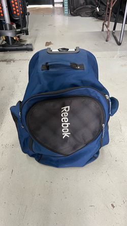 Reebok Rolling Duffle Bag and hockey gear